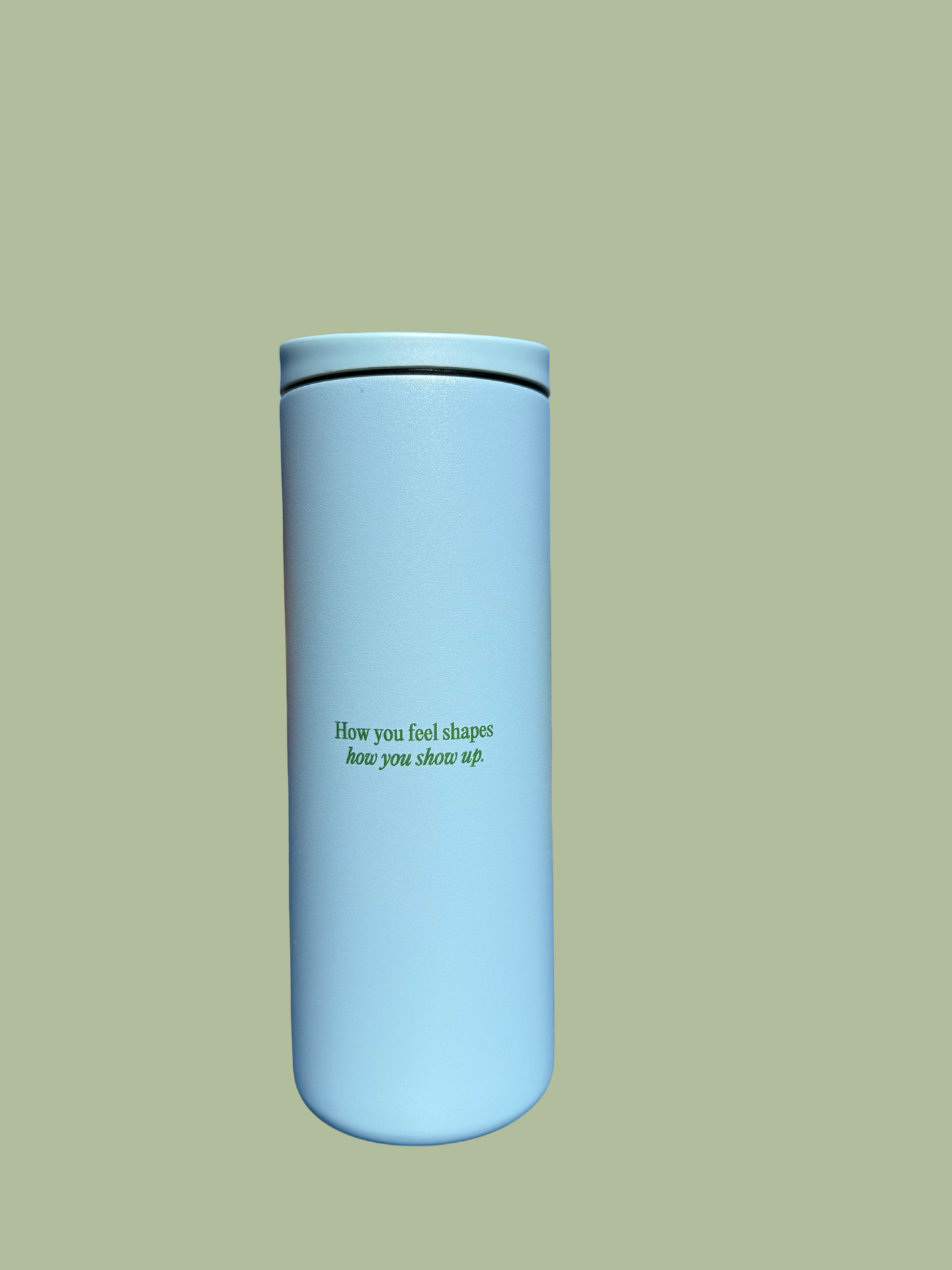 TruBond x Miir home light blue tumbler with How you feel shapes how you show up on a light green background